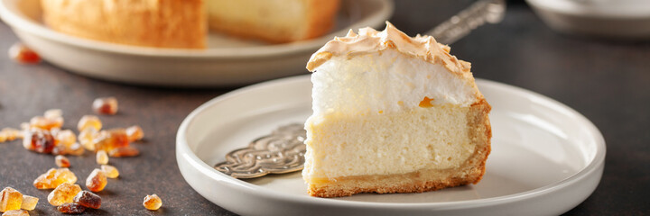 Delicious homemade cheesecake with glazed merengue. - obrazy, fototapety, plakaty