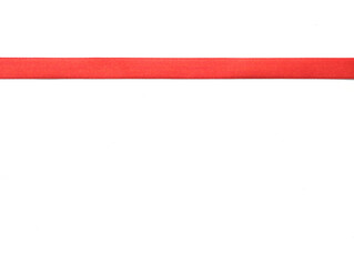 Obraz premium Red ribbon on white background with copy space for your text.