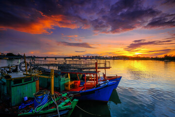 Parked fishing boat during sunset at Kuala Besut