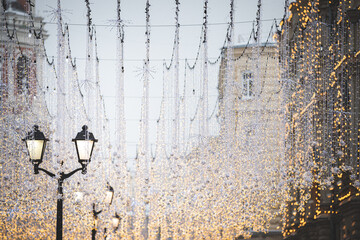 Christmas decorations in the center of New Year's Moscow. A large number of lanterns and garlands on Nikolskaya Street before Christmas. Winter and holidays concept. Red Square, Moscow, Russia