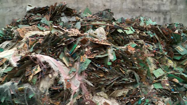Pan on a Mountain of electronic waste in Abidjan, Africa - E-waste from Old Computers and Equipements, is a major concern to ecologists around the world.