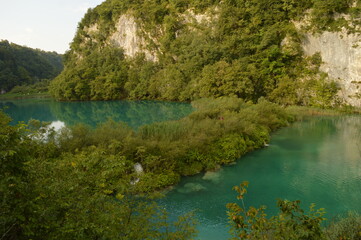 The pathways around the turquoise clear water in the Plitvice Lakes National Park in Croatia