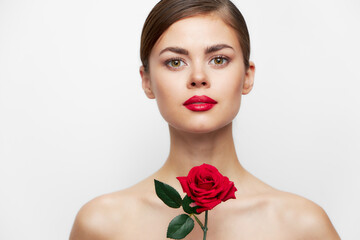 Naklejka premium Lady with rose Looks ahead red lips, clear skin luxury light 