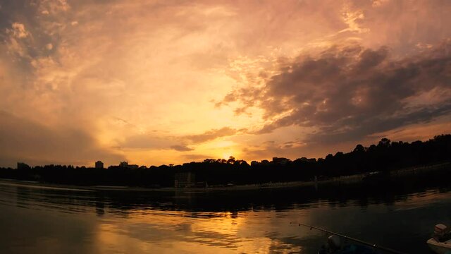 Timelapse of sunset and fishing graded