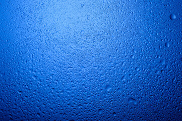 
water drops on glass on blue background1