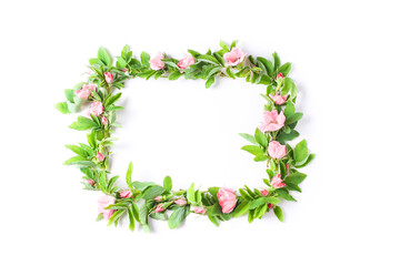 beautiful frame of fresh flowers on a white background. pink buds and green rose leaves. flat lay, copy space