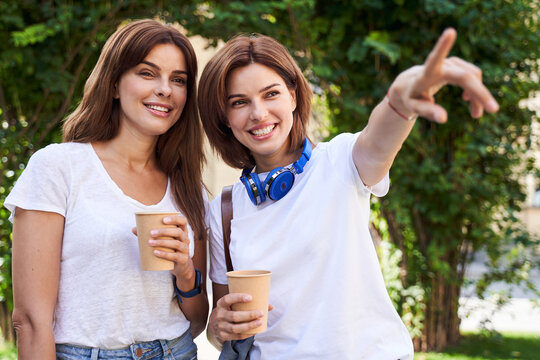 Students walking on sunny street