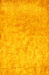 Bright yellow rough wall as background