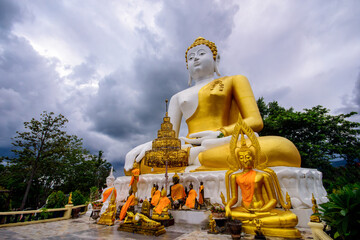 Fototapeta premium Buddha statue at Wat Phra That Doi Kham in Chiang Mai thailand