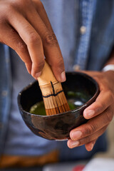 Preparing traditional green matcha tea