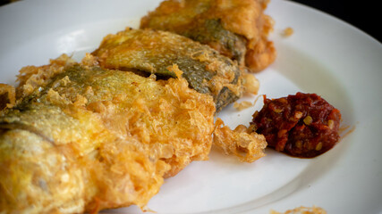 Bandeng Presto Goreng. Fried tendered-bone milkfish served with traditional side dishes