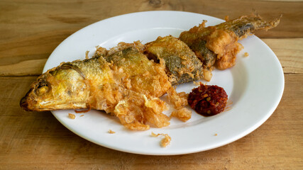 Bandeng Presto Goreng. Fried tendered-bone milkfish served with traditional side dishes