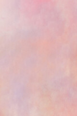 Pink-red weathered textured wall with some small white spots and dirt. Artistic cloudy watercolor background. Abstract art.