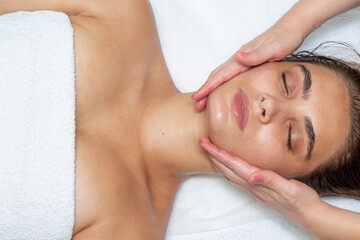 Fototapeta na wymiar relaxing facial massage in the spa salon