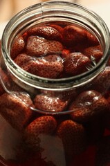 Delicious compote with strawberries in a jar