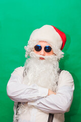 Portrait of stylish Santa Claus on color background
