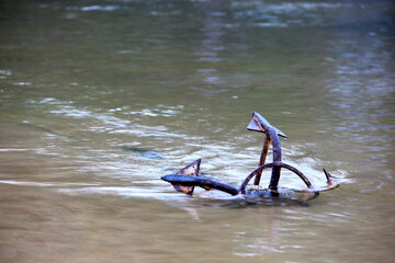 Anchor on Baga beach,  with flowing water, Goa, India