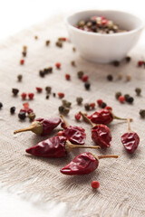 Dry spices, peppercorn and chili pepper on the coarse texture