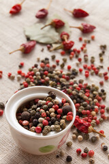 Dry spices, peppercorn and chili pepper on the coarse texture