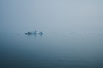 single small Icebergs in Jokulsarlon, blue cold lake