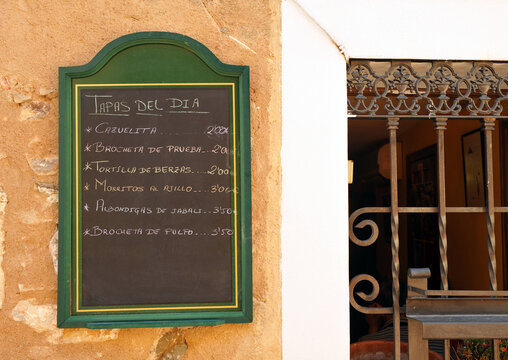 Blackboard with the tapas of day written in chalk in a Spanish bar