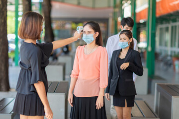 Visitors must go through fever measures using infrared digital thermometer check temperature...