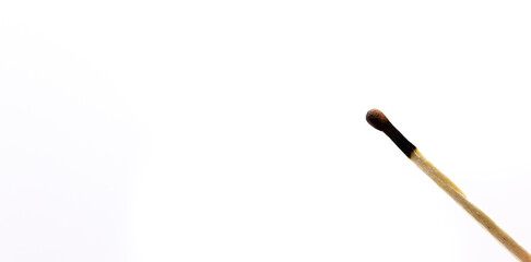 Lighted match on white isolated background photo