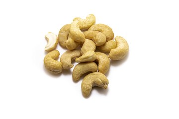 Large pile of cashew nuts on white isolated background macro photo