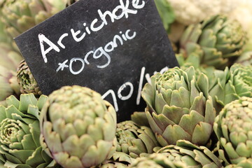 Artichokes on display for sale at organic market