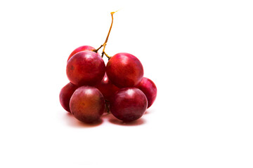 Bunch of red grapes on white isolated background