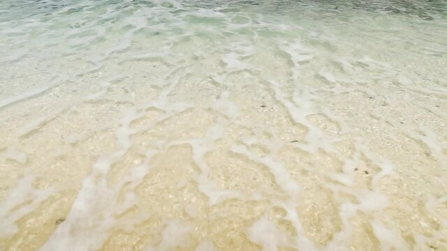 Sea waves in a tranquil bay of Batanes, Philippines