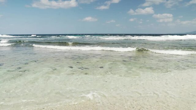 Sea waves in a tranquil bay of Batanes, Philippines
