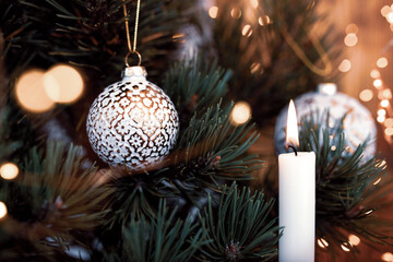Christmas tree decoration
Christmas tree decoration with balls and candlelight. Close-up with...
