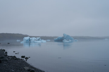 single small Icebergs in Jokulsarlon, blue cold lake