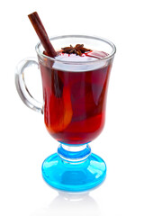 Hot red mulled wine isolated on white background with christmas spices, anise and cinnamon sticks 