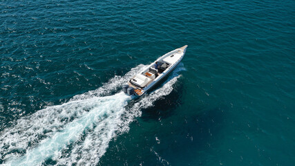 Aerial drone photo of luxury inflatable speed boat cruising in deep blue Aegean sea, Mykonos...