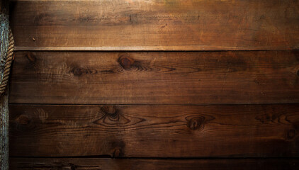 vintage wooden barn wall with post and rope accent on the side