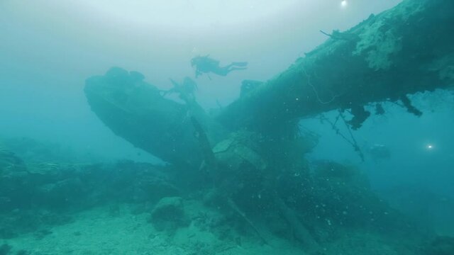 Scuba diving on world war 2 wreckage. Shot in the Solomon Islands.
