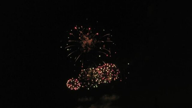 Aerial footage of fireworks over water. Rhine, Hesse, Germany.