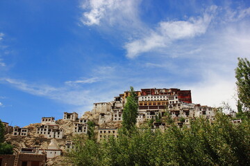 Fototapeta na wymiar Thikse Gompa, Thikse Monastery, Ladakhi, Tiksey, Thiksey or Thiksay, gompa, Tibetan-style monastery, Leh, Ladakh, India with mountains and blue sky