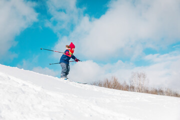 Naklejka na ściany i meble cute little girl ski in winter nature, kids seasonal sport