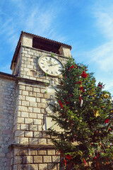 Fototapeta na wymiar View of Clock Tower in Old Town of Kotor on sunny winter day, Montenegro