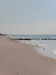 Rockaway Beach, New York. View of the ocean.  Panoramic beach landscape. Empty tropical beach and seascape. soft sand, calmness, tranquil relaxing sunlight
