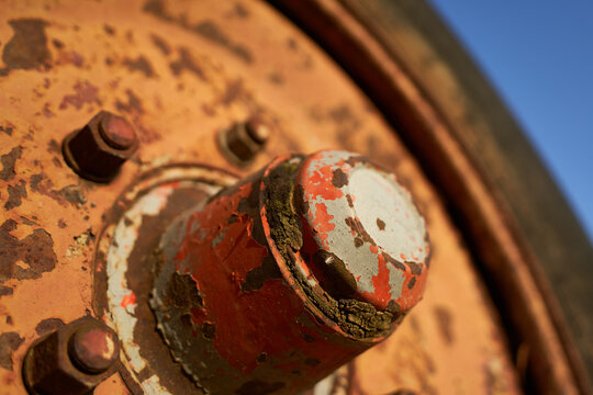 Old tire on a rusty manure trailer. Copy-space. Germany, Neuhausen.