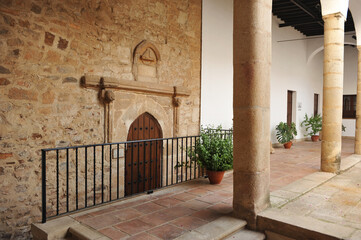 Fototapeta na wymiar Portada de la torre del obispo Castro Nuño. Patio del palacio episcopal de Cáceres, España