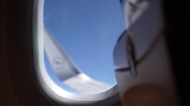 Airplane window view with focus pull