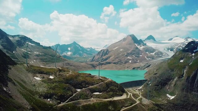 Catchment Lake in the Mountains with Wind Wheels Griessee Nufenenpass Switzerland