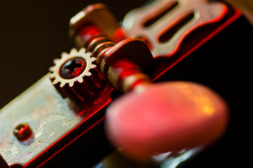 Tuning mechanics of a guitar in detail, detailed photo of tuning screws of a guitar, guitar...