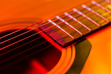 Obraz premium Details of an acoustic guitar, detailed photos of a guitar, guitar strings and soundhole, abstract, blurring, macrophoto