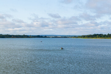 Obraz premium Boat with a fisherman in a big lake